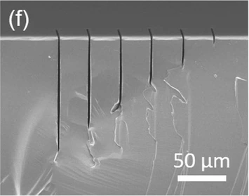 SEM cross-section of high-aspect-ratio slits scribed and etched into sapphire